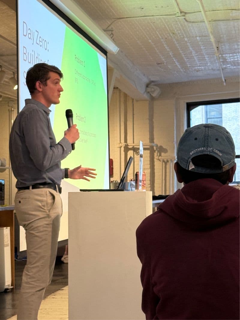 Jonah speaking with a microphone at a SonarQube User Group meetup
